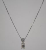 An 18ct white gold and diamond pendant and necklace chain.