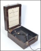 A vintage early to mid 20th century oak cased Optometrists mobile eye test kit.