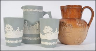 A 19th century Bristol pottery stoneware Harvest jug together with a Copeland Spode Jasperware jug