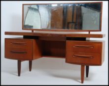 A 1970's G-Plan teak wood dressing table in the manner of Mogens Kolo.