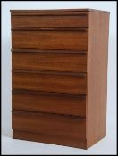 A 1970's teak wood Danish influence pedestal chest of drawers being raised on an inset plinth with