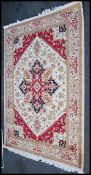 A large North Western Iranian / Persian Heriz carpet - rug having beige ground with geometric
