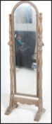 An early 20th century Oak framed Cheval swing mirror.