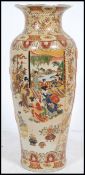 Large 20th century floor standing Satsuma style baluster vase having village scenes within panels