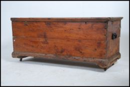A 19th century large pine coffer / blanket box chest having twin brass locks with brass oval key