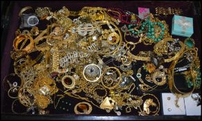 An extensive collection of costume jewellery to include brooches, bracelets, bangles etc.