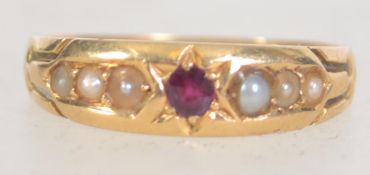 An 18ct gold, ruby and pearl ladies gypsy ring.