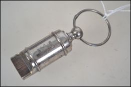 An unusual brushed steel whistle being marked for S.