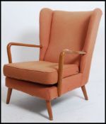 A vintage mid century Parker Knoll style armchair.