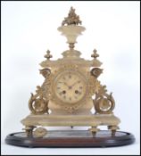 A Victorian alabaster mantel clock with gilded finials inset brass movement striking on a bell ( af