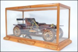 An impressive hand carved and crafted cased wooden model of the 1911 Stanley Steamer 20-30hp being
