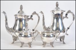 An Edwardian silver plated continental four tea service consisting of teapot,