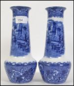 A pair of blue and white baluster vases with classical scenes in the Venetia pattern by Barker Bros
