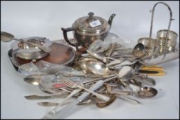 A collection of silver plate wares and flatwares to include pierced rectangular salver, teapot,