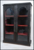A 19th century anglo-colonial carved library bookcase cabinet.