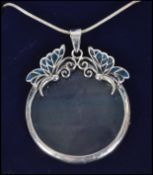 A ladies silver and plique a jour necklace and pendant loupe eye glass. Total weight 18.