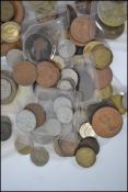 A collection of vintage and contemporary coins from around the world dating from the 19th century