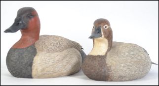 A pair of beautiful hand carved wooden painted ducks / decoy's.