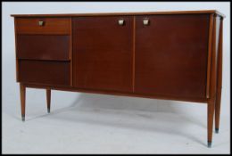 A 1970's retro sideboard in the manner of Peter Hayward for Vanson.