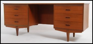 A 1970's retro / vintage teak wood Danish influence inverted bow front writing table desk.