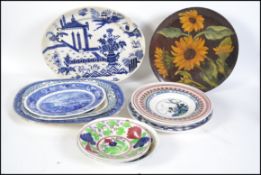 A collection of 19th century and 20th century Bristol pottery plates.