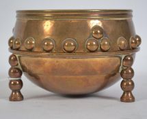 A late 19th century Arts & Crafts copy of the 'Glastonbury bowl ' A bronze bowl and stand found at