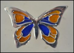 A ladies silver contemporary Plique a Jour brooch in the form of a butterfly with pin verso.