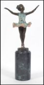 An Art Deco bronze figurine of a child ballet dancer having remains of paintwork to the dress and