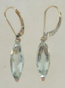 A pair of 9ct gold drop earrings with yellow stone. Weight 2.6g.