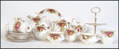 An extensive Royal Albert bone China tea service consisting of teapot, water pot, trio's, creamer,