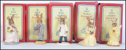 A group of five boxed ceramic Royal Doulton Bunnykins figures to include Groom Bunnykins,