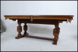 A Riley of Accrington good quarter-size 1930's Art Deco solid oak snooker / dining table resting on