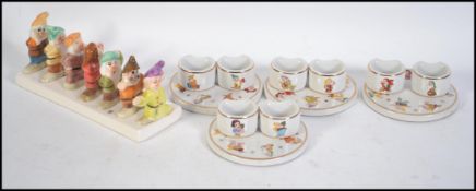 A Snow White and The Seven Dwarfs promotional toast rack for Clover butter together with a set of