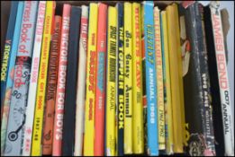 A Collection of over 20 TV and Film related annuals - James Bond Huckleberry Hound Burkes Law etc