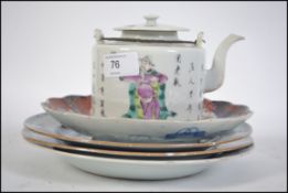 A group of 19th and 20th century chinese and Japanese ceramics to include three blue and white