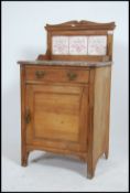A Victorian satin walnut and marble wash stand chest having rouge marble top and splashback over