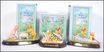A group of three Royal Doulton Winnie the Pooh Collection 