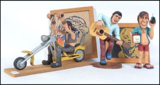 An impressive hand carved and crafted wooden easy rider chopper motorcycle and rider together with