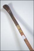 A late 19th century walking cane / finishing stick.