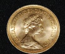 Coins. An Elizabeth II gold Sovereign, 1974, St George and the Dragon to verso. Total weight 8.