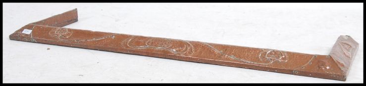 A vintage early 20th century Arts and Crafts copper kerb fire fender measuring 128cm wide.