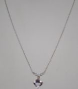 A hallmarked 9ct white and yellow gold diamond and pale purple stone necklace and earring suit.