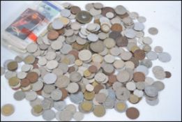 A collection of coins and notes from around the world dating from the 19th century to include a 10,