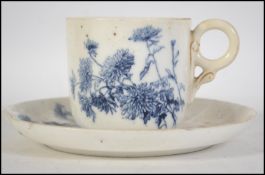 A 19th century Royal Worcester blue and white teacup and saucer having puce marks to the underside
