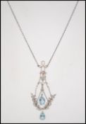 An Edwardian 18ct gold Art Nouveau pendant necklace strung with stylized rose cut diamond set