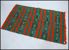 A Moroccan camel wool handwoven tapestry worked floor rug carpet with symbol work having green and