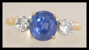 A hallmarked 18ct gold sapphire and diamond three stone ring set with. Diamonds approx 40pts.