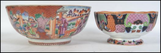 A 19th century Chinese Imari bowl handpainted with court & family scenes with further scene to the