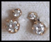 A pair of hallmarked 9ct gold and diamond earrings. Hallmarked Birmingham.