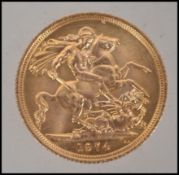 Coins. An Elizabeth II gold Sovereign, 1974, St George and the Dragon to verso. Total weight 8.